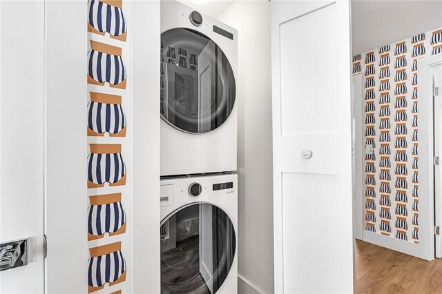 413 Atlantic Ave, Westerly, RI 02891 - laundry room featuring stacked washing machine and dryer and wood finished floors
