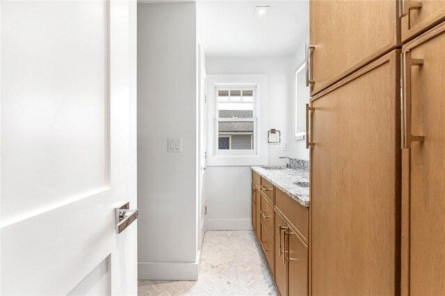 413 Atlantic Ave, Westerly, RI 02891 - bathroom with double vanity and baseboards