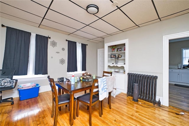 62 School St, Fall River, MA 02720 - dining area with radiator heating unit and light wood finished floors