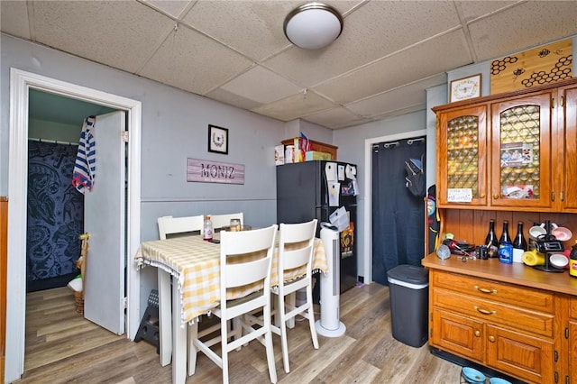 62 School St, Fall River, MA 02720 - dining room featuring a paneled ceiling and light wood-style floors