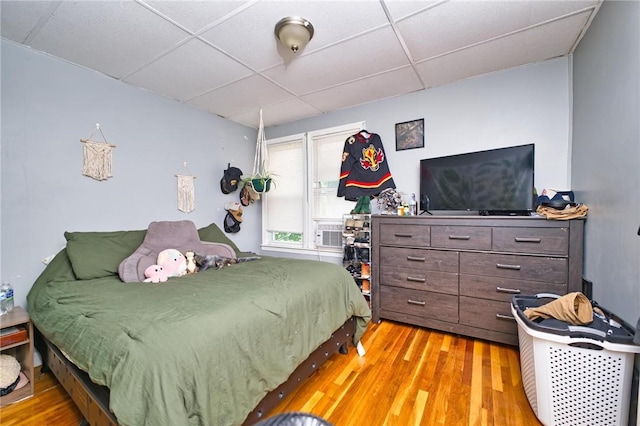 62 School St, Fall River, MA 02720 - bedroom with a paneled ceiling and light wood-style floors