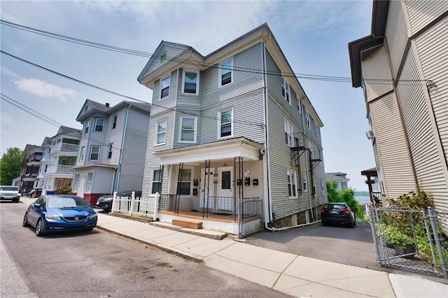 62 School St, Fall River, MA 02720 - townhome / multi-family property featuring a porch