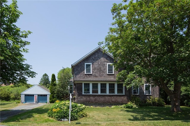 201 Paradise Ave, Middletown, RI 02842 - view of front facade with a garage, an outbuilding, and a front yard