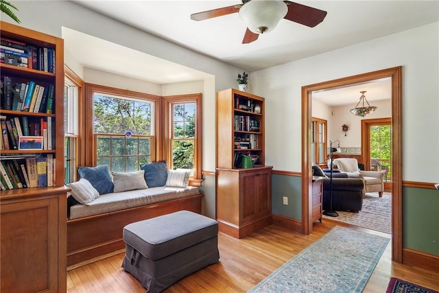 201 Paradise Ave, Middletown, RI 02842 - living area with light wood-style flooring, ceiling fan, and baseboards