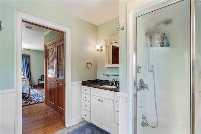 201 Paradise Ave, Middletown, RI 02842 - full bathroom featuring wainscoting, a stall shower, vanity, wood finished floors, and ensuite bath