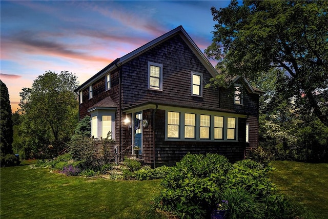 201 Paradise Ave, Middletown, RI 02842 - property exterior at dusk featuring a lawn