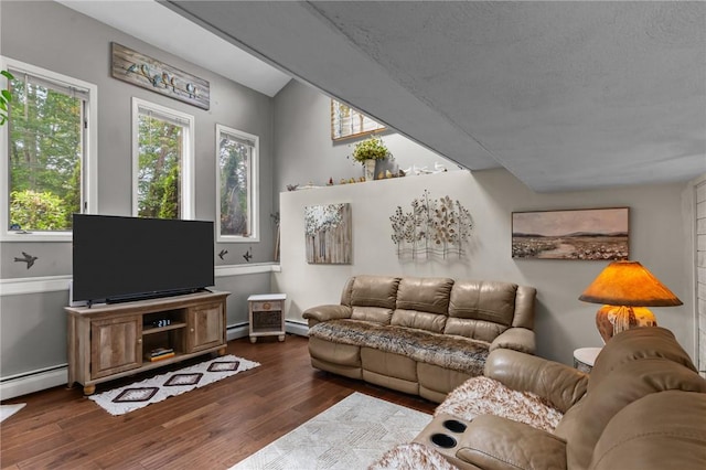 68 Everglade Ave, Warwick, RI 02886 - living area with dark wood-type flooring, baseboard heating, and a baseboard heating unit