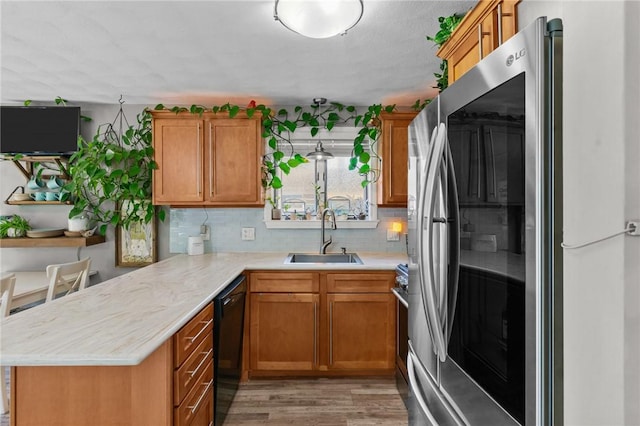 68 Everglade Ave, Warwick, RI 02886 - kitchen with smart refrigerator, light countertops, a peninsula, dishwasher, and light wood-style floors