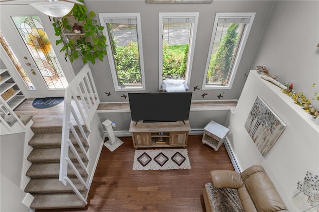 68 Everglade Ave, Warwick, RI 02886 - living area featuring stairs, dark wood finished floors, a baseboard heating unit, and baseboard heating