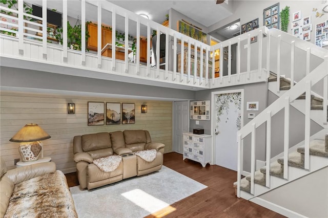 68 Everglade Ave, Warwick, RI 02886 - living area featuring wood walls, wood finished floors, stairs, and a towering ceiling