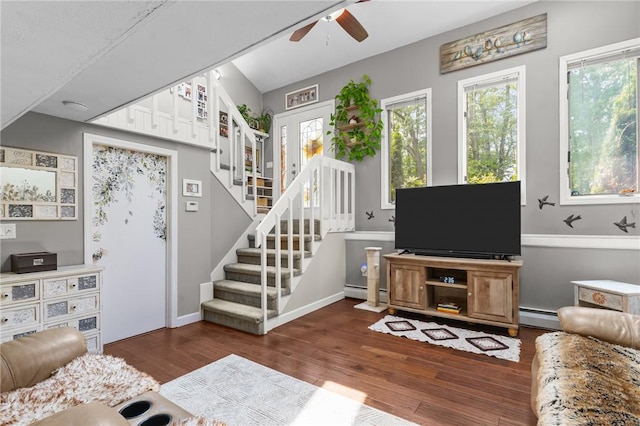 68 Everglade Ave, Warwick, RI 02886 - living room featuring a ceiling fan, stairs, wood finished floors, and baseboard heating