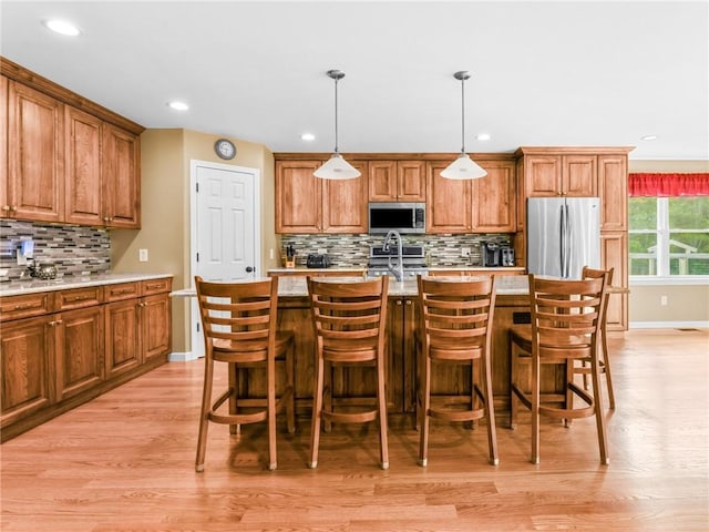 162 Pine Orchard Rd, Glocester, RI 02814 - kitchen featuring appliances with stainless steel finishes, baseboards, decorative backsplash, light wood-type flooring, and recessed lighting