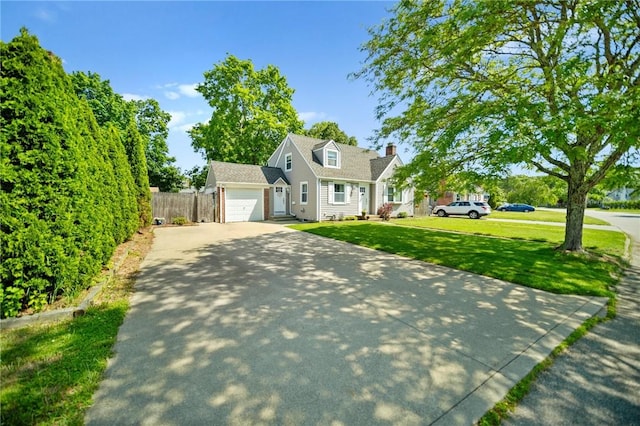 79 Pilgrim Dr, Warwick, RI 02888 - view of front of property with driveway, a garage, and a chimney