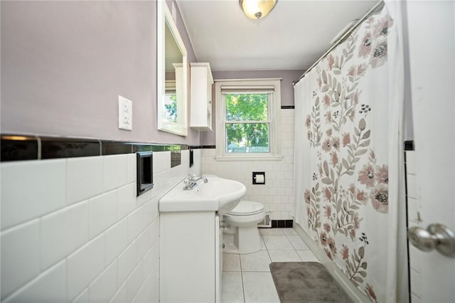79 Pilgrim Dr, Warwick, RI 02888 - bathroom with tile walls, tile patterned flooring, vanity, toilet, and curtained shower