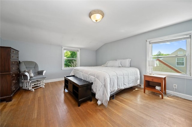 79 Pilgrim Dr, Warwick, RI 02888 - bedroom featuring wood finished floors, vaulted ceiling, and baseboards