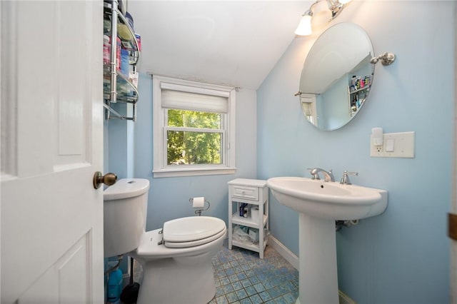 79 Pilgrim Dr, Warwick, RI 02888 - half bathroom with toilet, baseboards, and a sink
