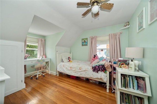 79 Pilgrim Dr, Warwick, RI 02888 - bedroom with wood finished floors, multiple windows, lofted ceiling, a ceiling fan, and baseboards