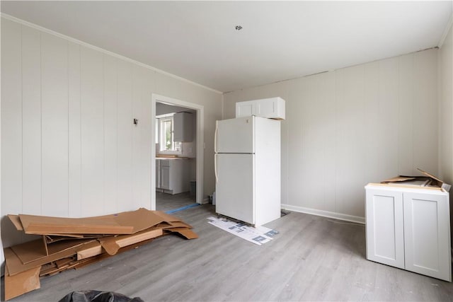 35 Laurel St, Pawtucket, RI 02860 - dining space with light wood-style floors, baseboards, and crown molding