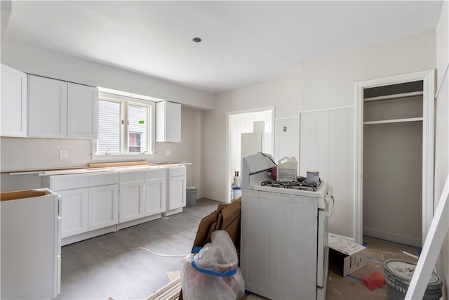35 Laurel St, Pawtucket, RI 02860 - kitchen featuring white gas range oven, white cabinets, and light countertops