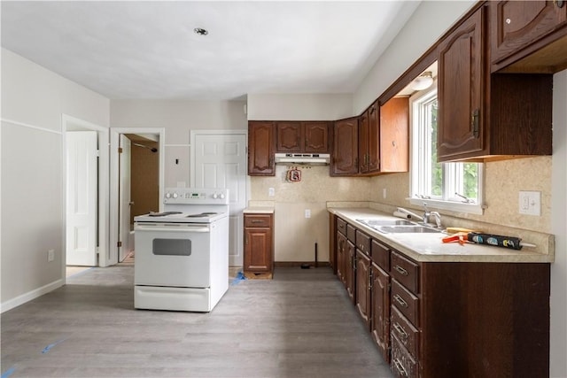 35 Laurel St, Pawtucket, RI 02860 - kitchen featuring white electric range oven, light wood-style floors, a sink, and under cabinet range hood