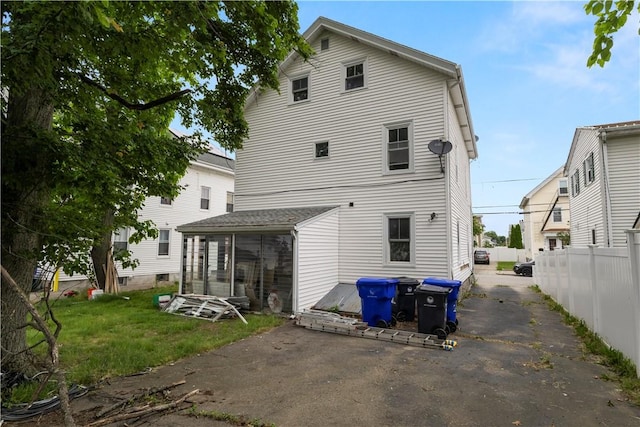 35 Laurel St, Pawtucket, RI 02860 - back of house with a sunroom, asphalt driveway, and a patio area