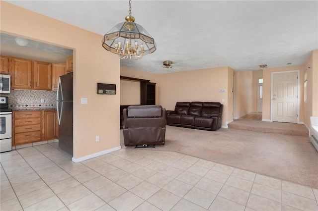 20 Pond Ct Unit A, North Providence, RI 02904 - living area with a chandelier, baseboards, light carpet, and light tile patterned floors