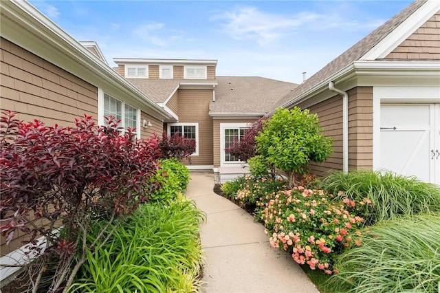 83 Waters Edge St Unit 24, Tiverton, RI 02878 - doorway to property featuring roof with shingles