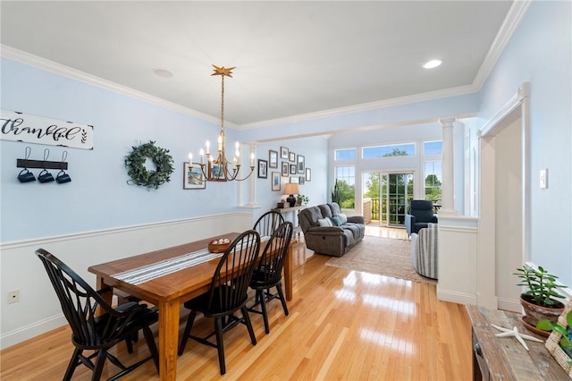 83 Waters Edge St Unit 24, Tiverton, RI 02878 - dining space with light wood-style flooring, crown molding, a chandelier, and baseboards