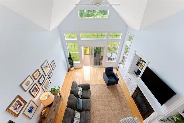 83 Waters Edge St Unit 24, Tiverton, RI 02878 - living room with high vaulted ceiling, wood finished floors, and a ceiling fan
