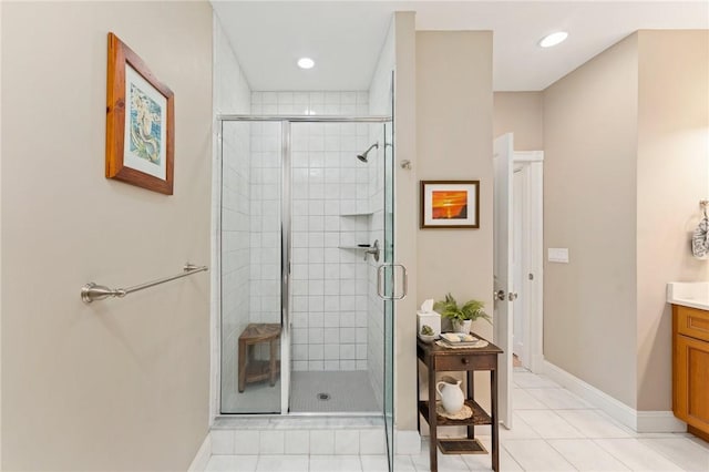 83 Waters Edge St Unit 24, Tiverton, RI 02878 - bathroom with vanity, a stall shower, tile patterned flooring, baseboards, and recessed lighting