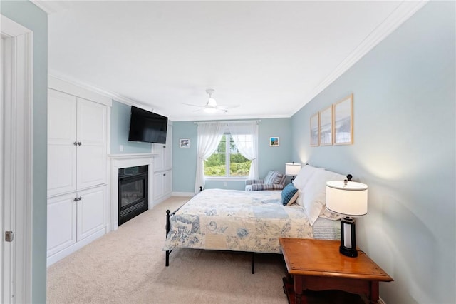 83 Waters Edge St Unit 24, Tiverton, RI 02878 - bedroom featuring light colored carpet, crown molding, a glass covered fireplace, a ceiling fan, and baseboards