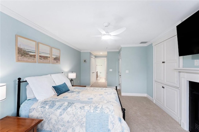 83 Waters Edge St Unit 24, Tiverton, RI 02878 - bedroom featuring ornamental molding, light colored carpet, baseboards, a ceiling fan, and a fireplace