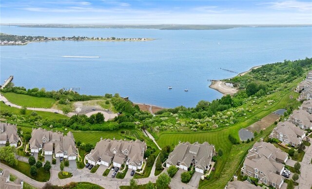83 Waters Edge St Unit 24, Tiverton, RI 02878 - aerial view of property and surrounding area with nearby suburban area and a large body of water