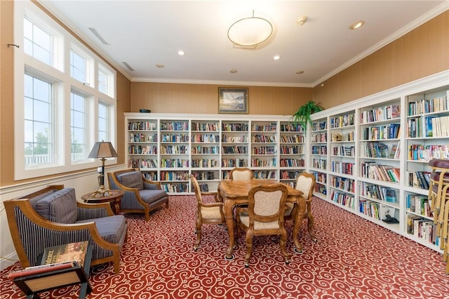 83 Waters Edge St Unit 24, Tiverton, RI 02878 - living area with wall of books, carpet, ornamental molding, and recessed lighting