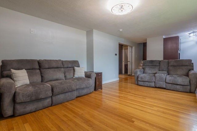 21 Baldwin Rd, Warwick, RI 02886 - living area with light wood-style floors and baseboards