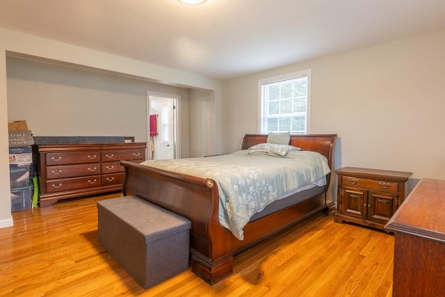 21 Baldwin Rd, Warwick, RI 02886 - bedroom with light wood-style flooring and ensuite bath