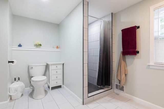 21 Baldwin Rd, Warwick, RI 02886 - full bath featuring toilet, tiled shower, baseboards, and tile patterned floors