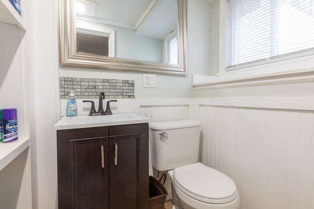 21 Baldwin Rd, Warwick, RI 02886 - half bathroom featuring vanity, toilet, and wainscoting
