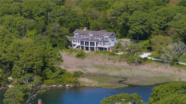 137 Cove Pt E, Charlestown, RI 02813 - aerial view of property and surrounding area with a heavily wooded area and a nearby body of water