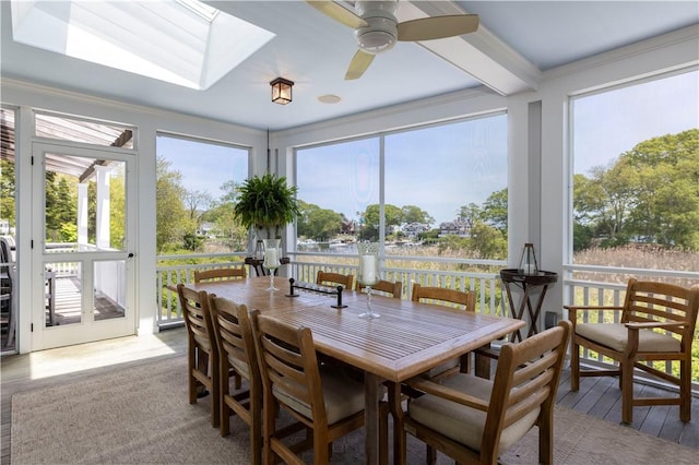 137 Cove Pt E, Charlestown, RI 02813 - sunroom featuring healthy amount of natural light, a skylight, wood finished floors, a deck, and ornamental molding