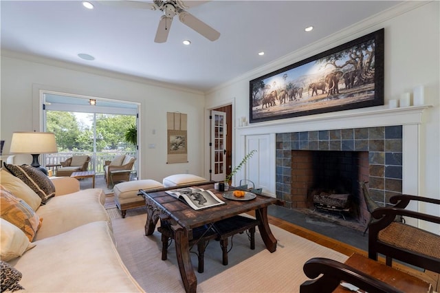 137 Cove Pt E, Charlestown, RI 02813 - living room featuring crown molding, a ceiling fan, a tile fireplace, and recessed lighting