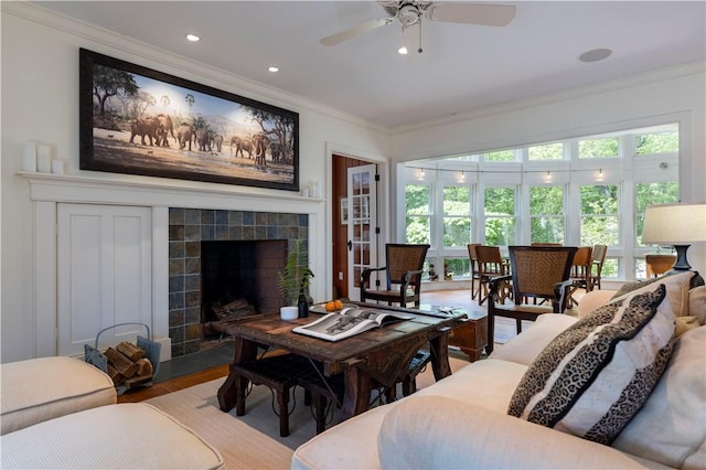 137 Cove Pt E, Charlestown, RI 02813 - living room with ornamental molding, ceiling fan, wood finished floors, a tile fireplace, and recessed lighting
