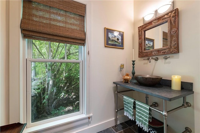 137 Cove Pt E, Charlestown, RI 02813 - doorway to outside featuring a sink and baseboards