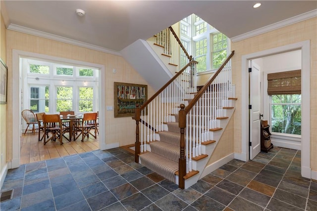 137 Cove Pt E, Charlestown, RI 02813 - stairs with stone tile floors, ornamental molding, plenty of natural light, and recessed lighting
