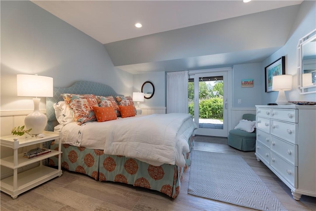 137 Cove Pt E, Charlestown, RI 02813 - bedroom with lofted ceiling, access to outside, wood finished floors, a wainscoted wall, and recessed lighting
