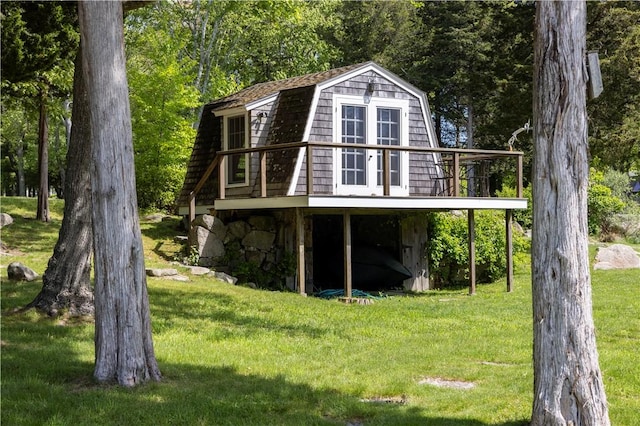 137 Cove Pt E, Charlestown, RI 02813 - view of side of property with a gambrel roof, a yard, and a deck