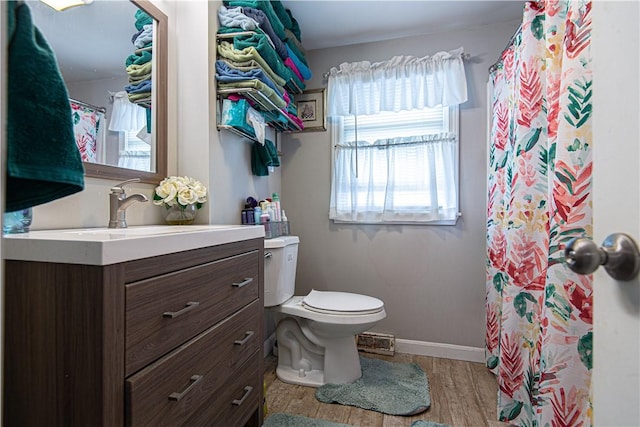 34 Zambarano Ave, North Providence, RI 02911 - full bath with vanity, healthy amount of natural light, wood finished floors, and curtained shower