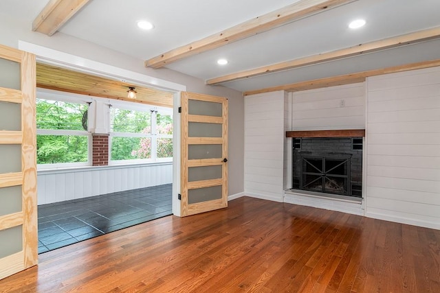 137 Rocky Hill Rd, Scituate, RI 02857 - unfurnished living room featuring beam ceiling, wood finished floors, a brick fireplace, and recessed lighting