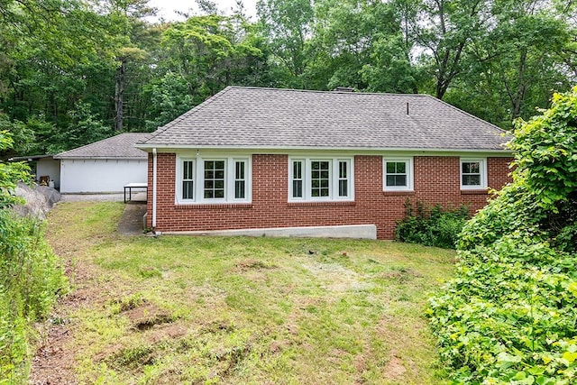 137 Rocky Hill Rd, Scituate, RI 02857 - view of front of property featuring roof with shingles, brick siding, and a front lawn