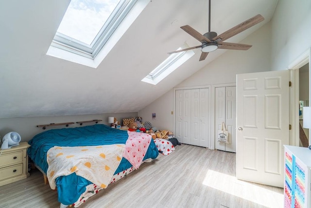 7 Tamarac Dr Unit F, Smithfield, RI 02828 - bedroom with a skylight, lofted ceiling, two closets, wood finished floors, and a ceiling fan